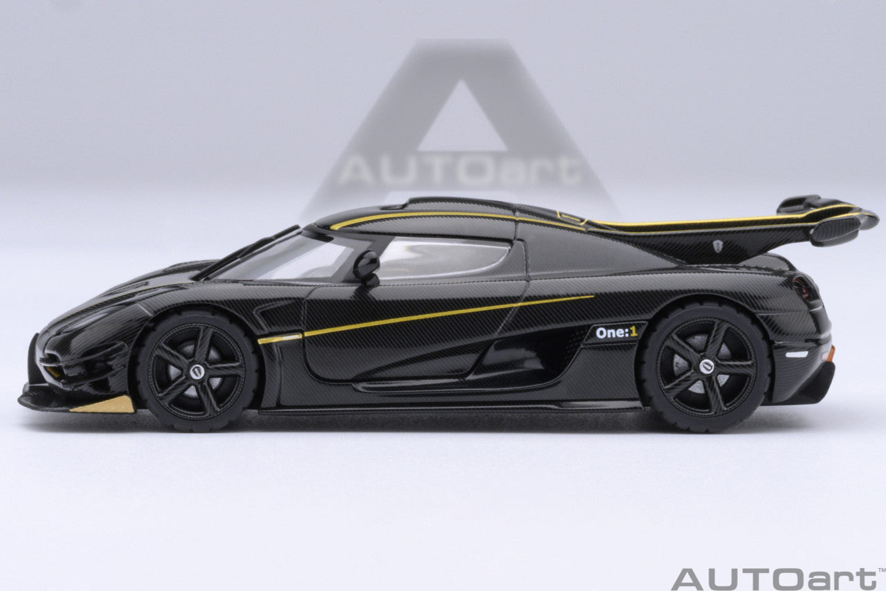 1:64 Koenigsegg One: 1 Clear Carbon Fibre/Gold Stripes - AutoArt 20043