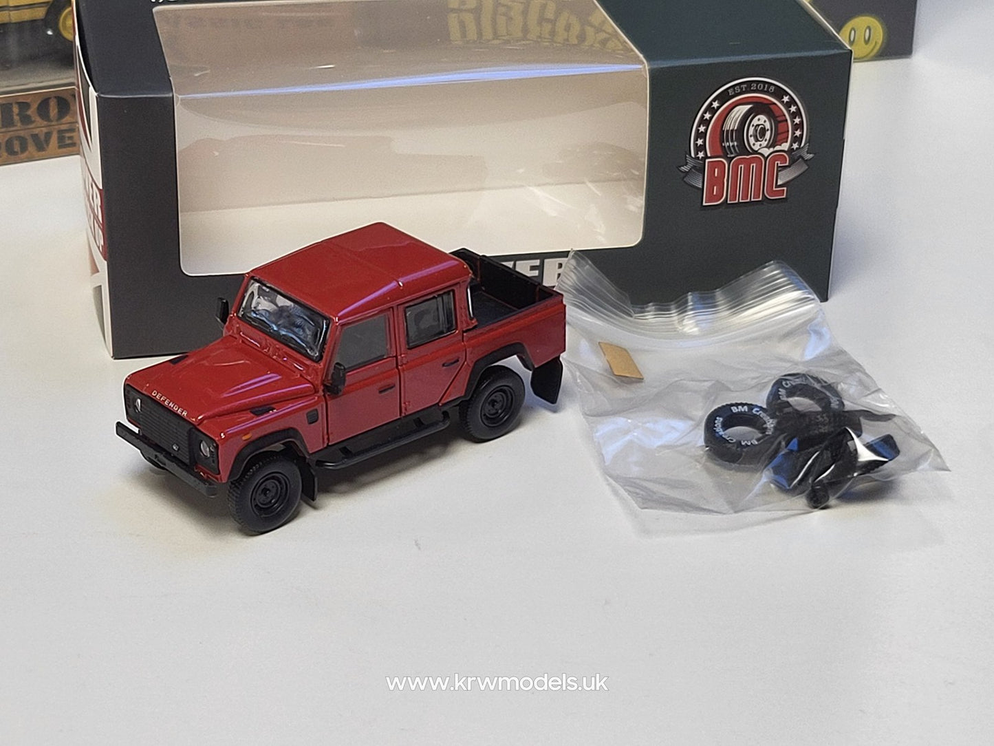 1/64 2016 Land Rover Defender 110 Pick-Up *Right Hand Drive*, red-orange - BM64B0267RHD